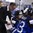 PLYMOUTH, MICHIGAN - APRIL 6: Team Finland head coach Past Mustonen draws up a play for his players Michelle Karvinen #21 and Riikka Valila #13 during the bronze medal game at the 2017 IIHF Ice Hockey Women's World Championship. (Photo by Minas Panagiotakis/HHOF-IIHF Images)